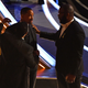 Denzel Washington (L), Will Smith (C) and Tyler Perry chat during the 94th Oscars at the Dolby Theatre in Hollywood, California on March 27, 2022.
